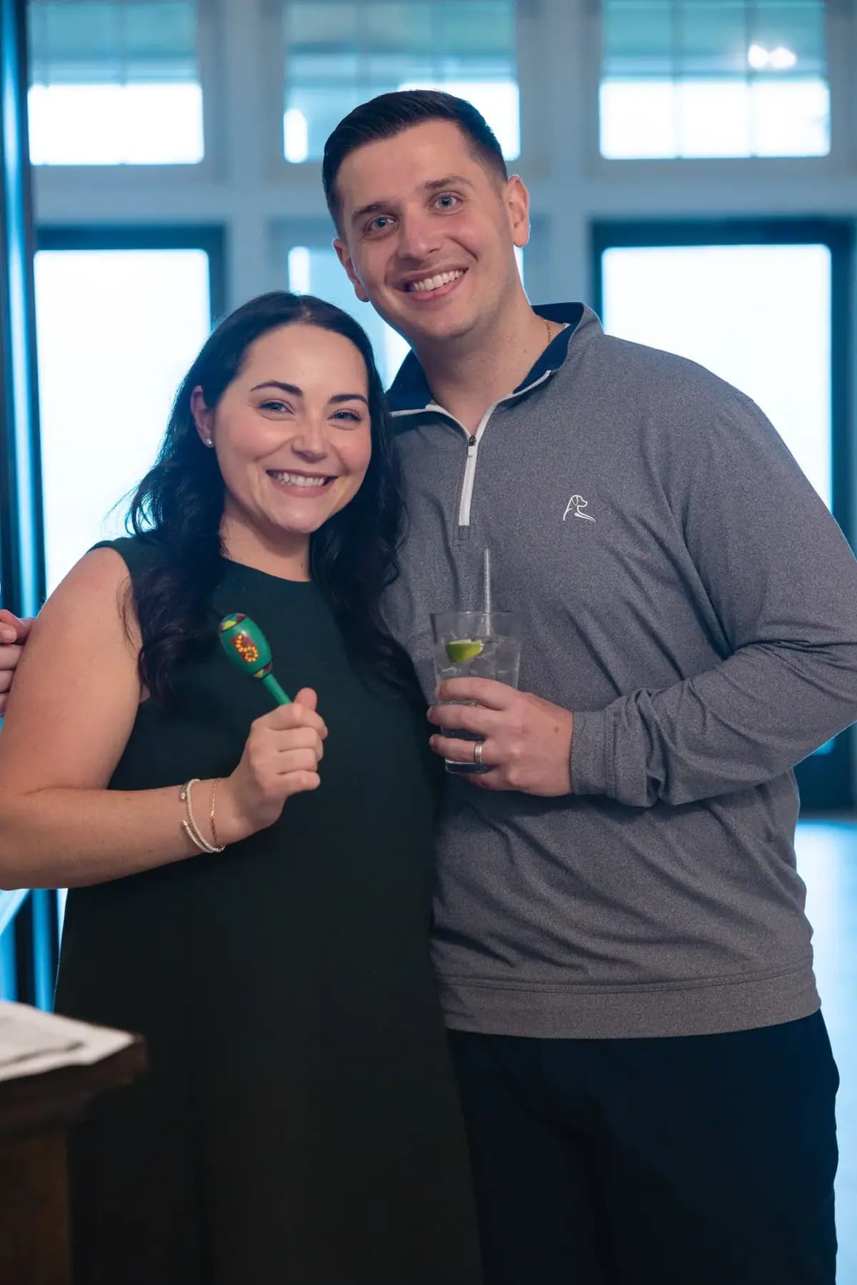 Smiling couple posing together in the clubhouse