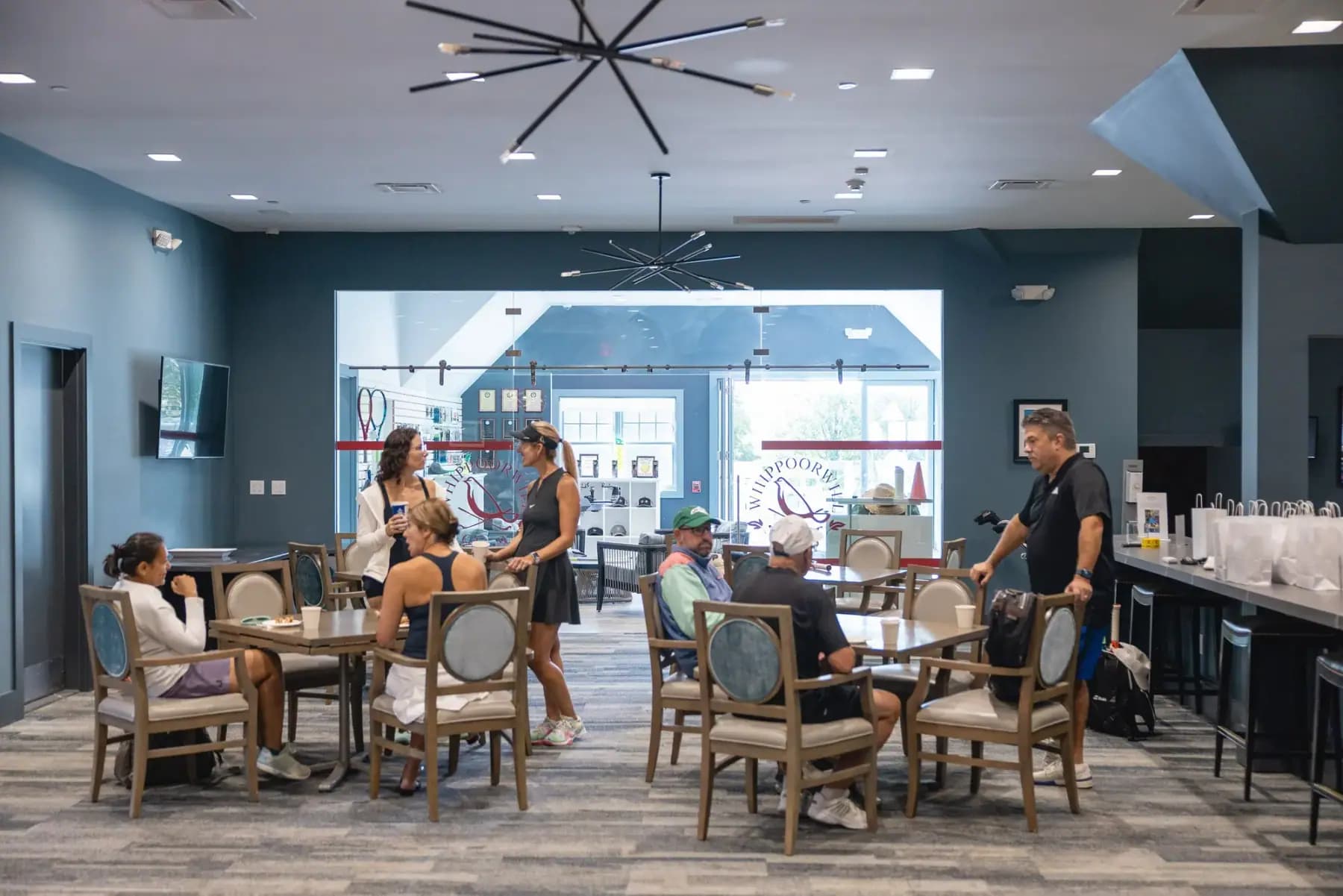 Clubhouse dining room with players seated at tables