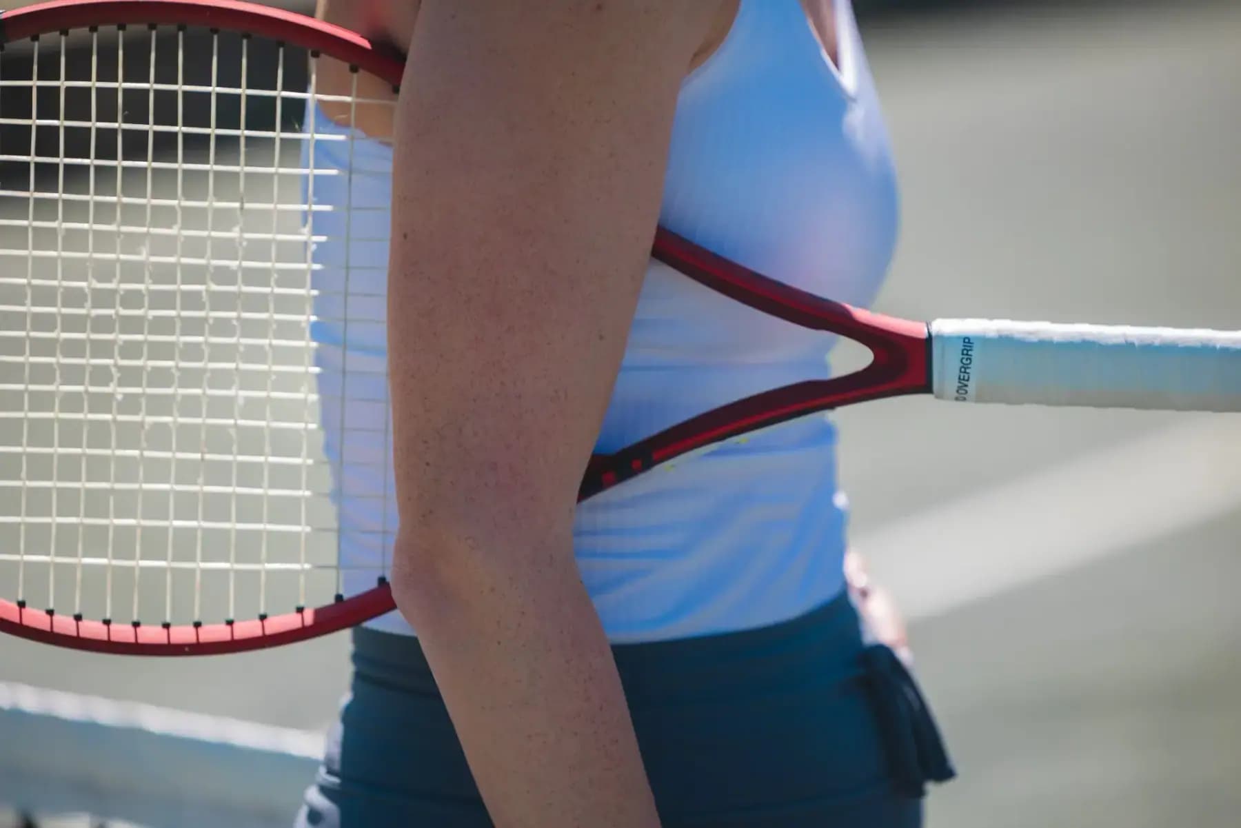 Close-up of a player holding a tennis racket