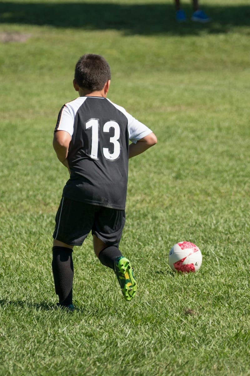 A child playing soccer